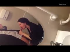 Bathroom blowjob in front of the mirror while out in the club
